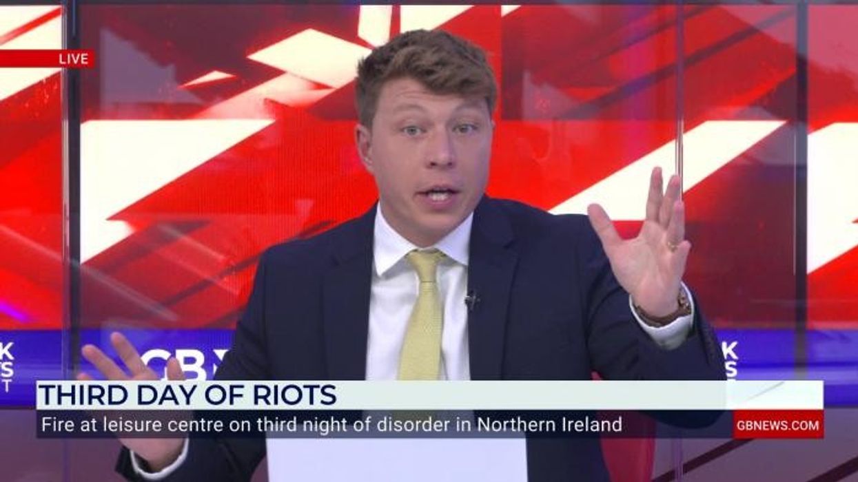 Northern Ireland locals display British flags outside their houses to deter rioters as third night of violence wreaks havoc