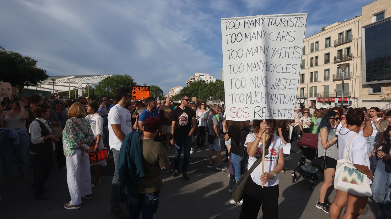 Dozens of people during a demonstration against tourist overcrowding and for decent housing