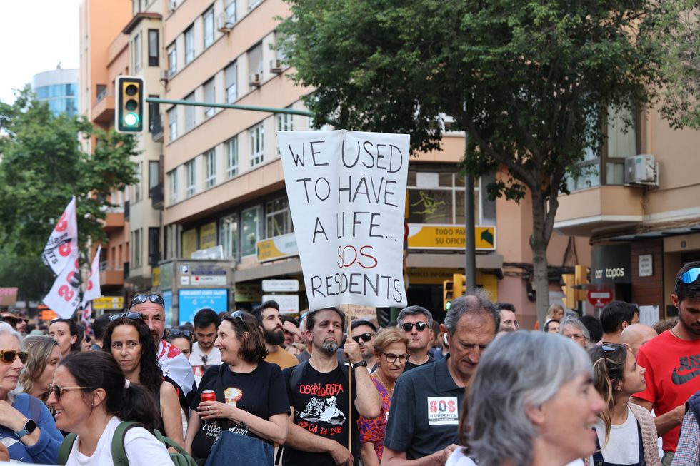 Dozens of people during a demonstration against tourist overcrowding and for decent housing