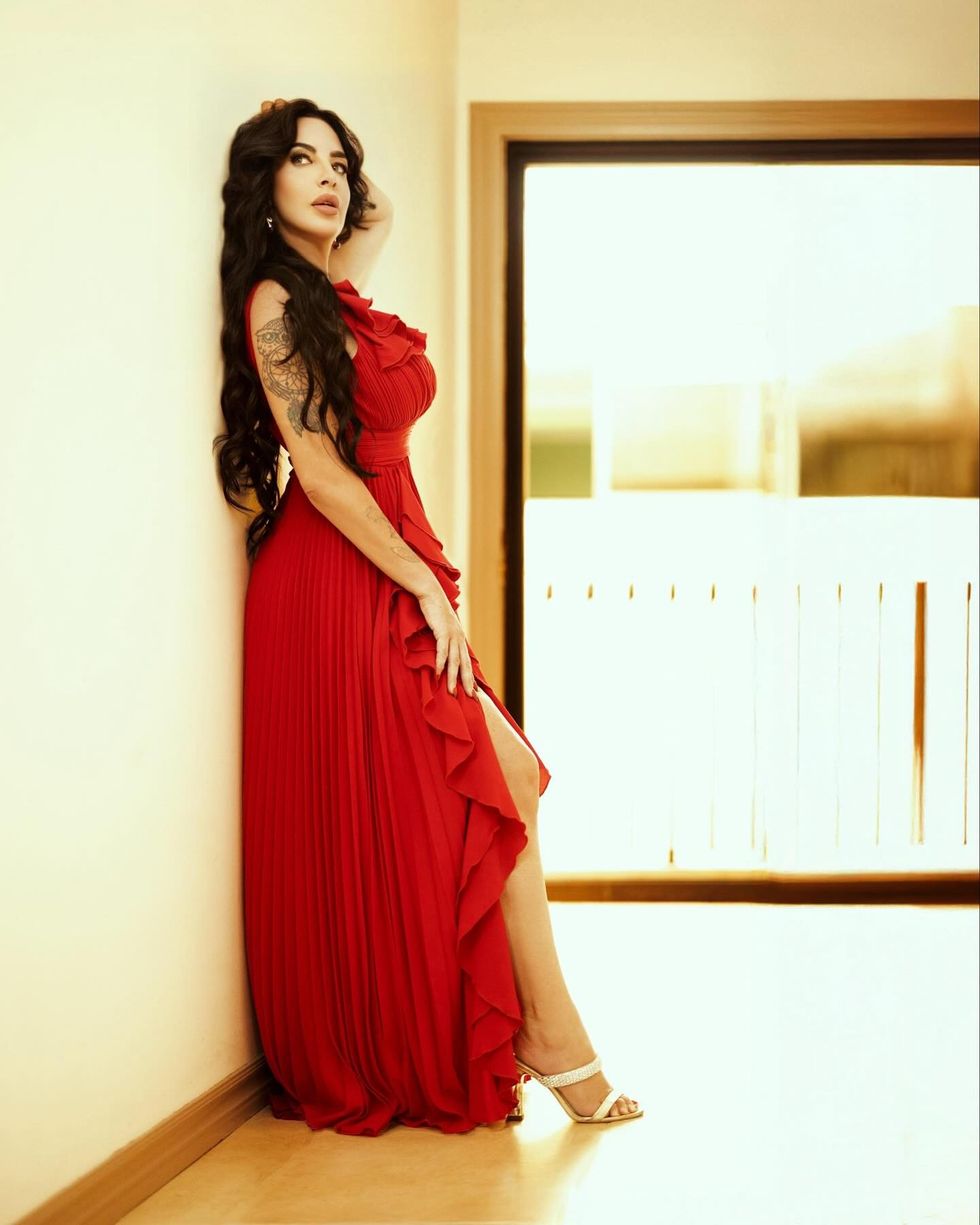 Dr Channa Bromley posing in red dress