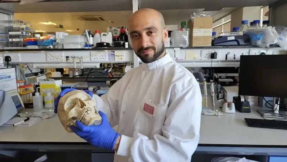 Dr Sherif Elsharkawy with a skull