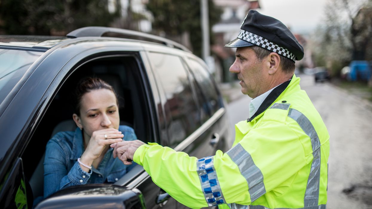 Driver being breathalysed by the police