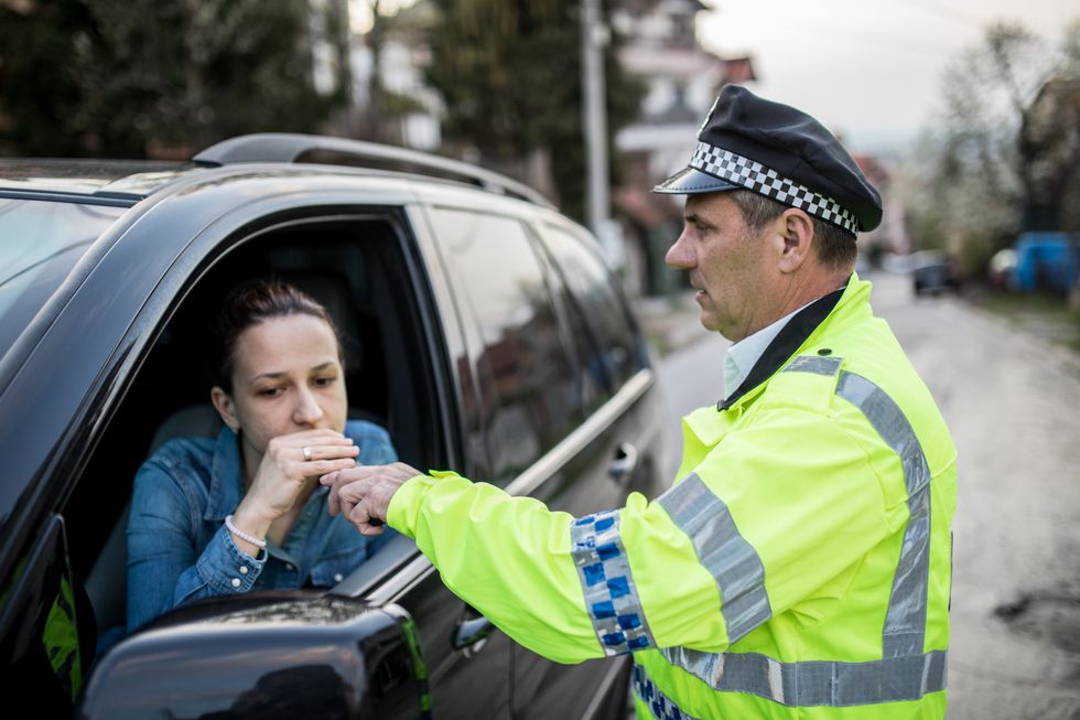 Driver being breathalysed by the police