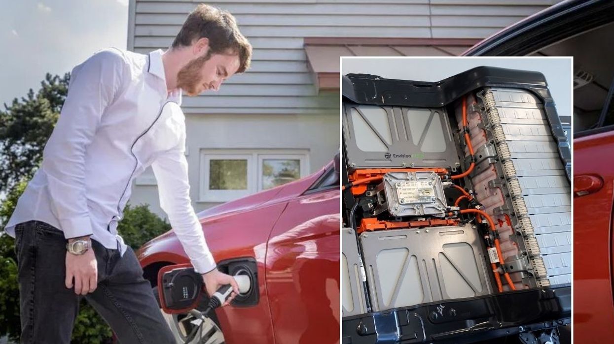 Driver charging electric car and an EV battery