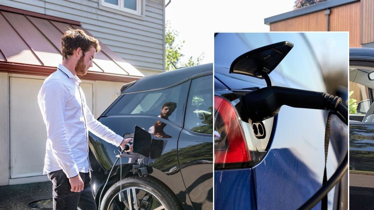 Driver charging electric car and an EV charger
