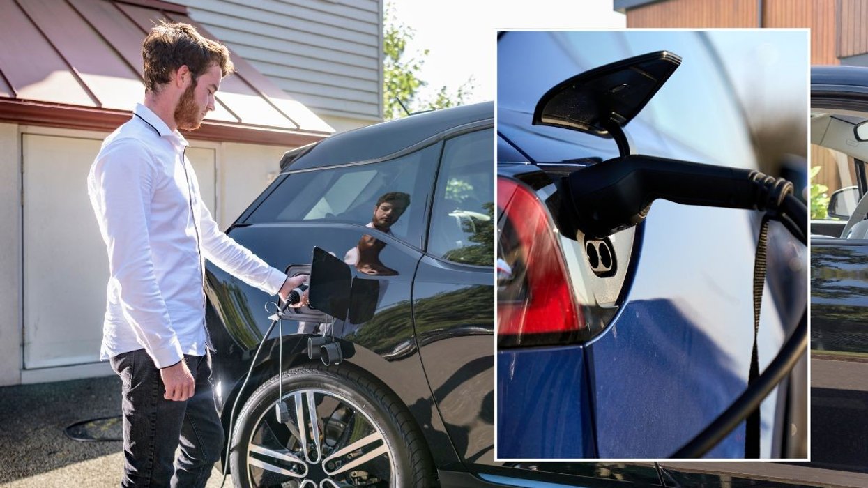 Driver charging electric car and an EV charger