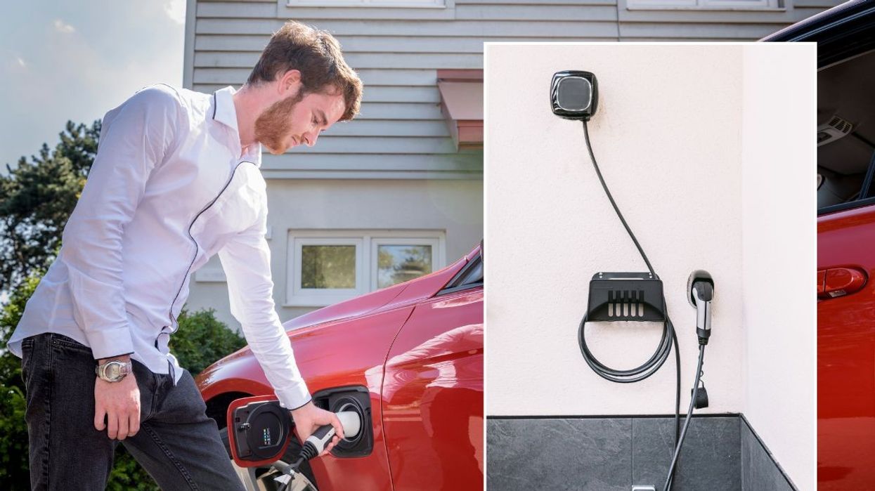 Driver charging electric vehicle and a home EV charger