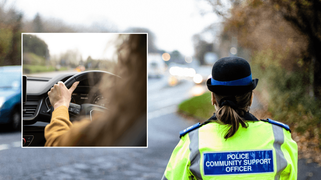 Driver in car and police officer