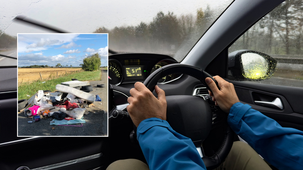 Driver in car and rubbish on the street