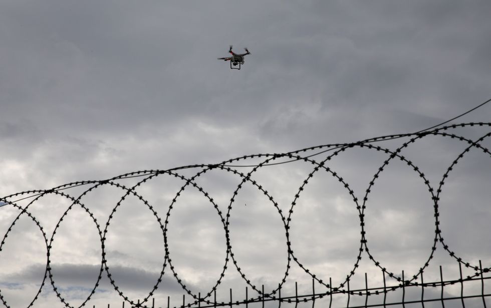 Drone above security fence