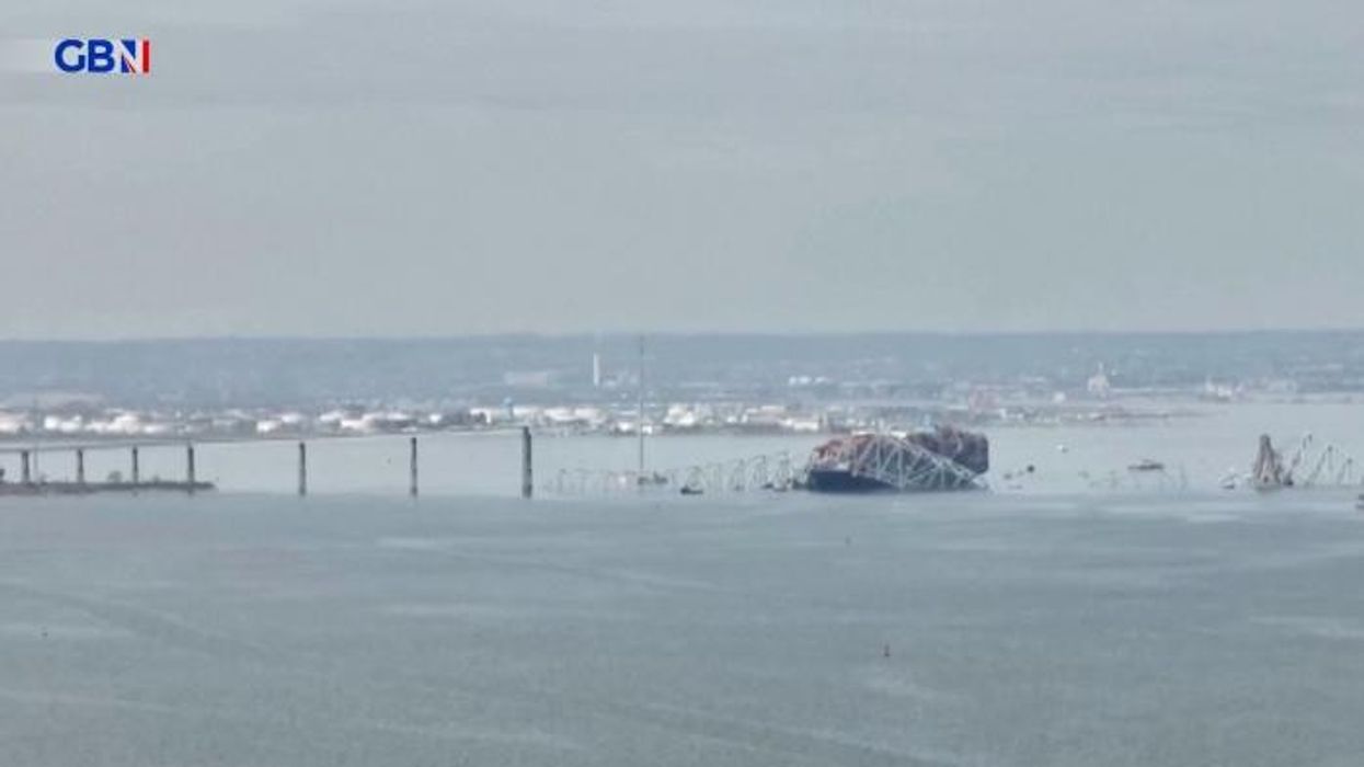 Baltimore bridge collapse: Body pulled from water amid intense search for those who fell into freezing waters