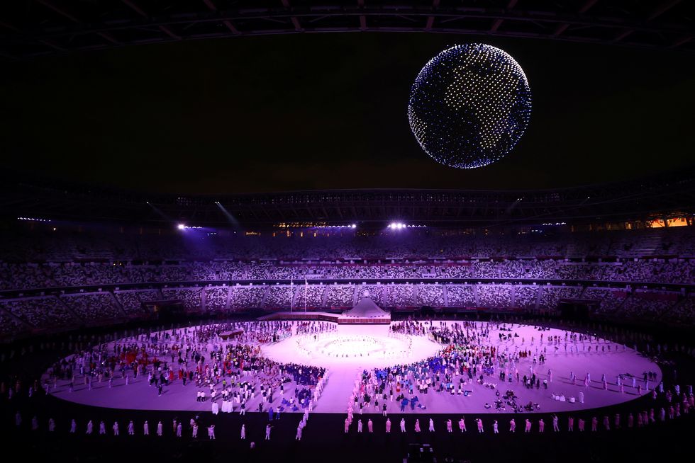 Drones are seen above the stadium during the opening ceremony.