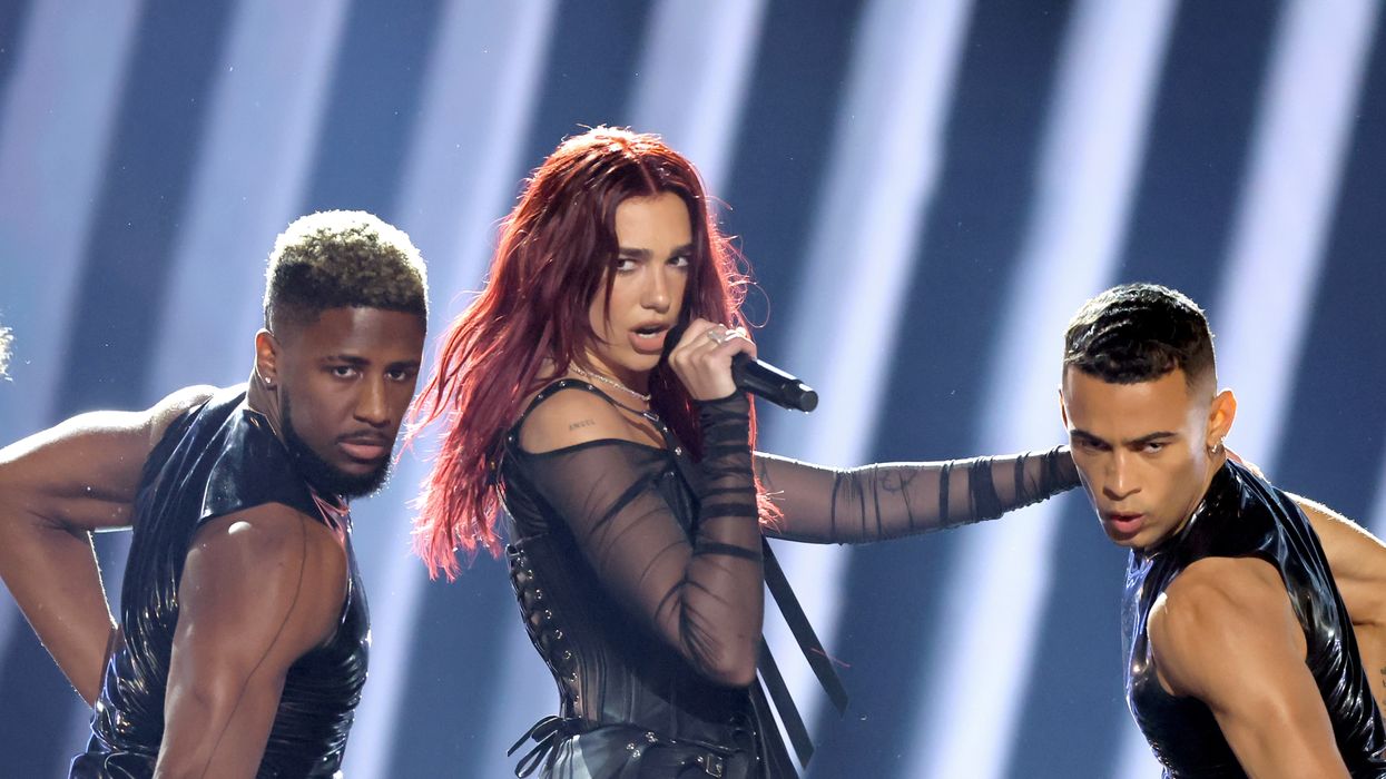 dua lipa pictured performing with dancers during the televised grammy awards