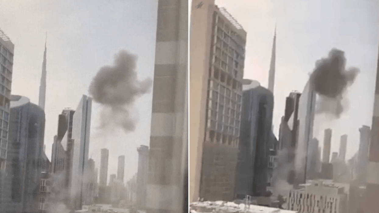 Dubai financial district rocked by explosion with black smoke seen billowing above skyline