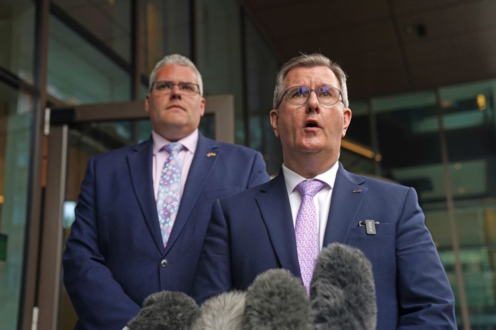 DUP leader Sir Jeffrey Donaldson (right) speaks to the media alongside Gavin Robinson outside the Grand Central Hotel in Belfast, following his meeting with Taoiseach Micheal Martin