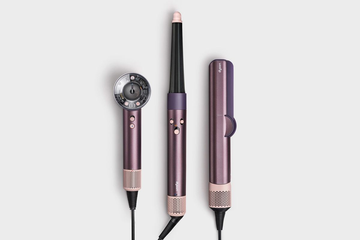 Dyson Airwrap, Airstraight, and Supersonic Nural hair dryer pictured in new jasper plum colourway