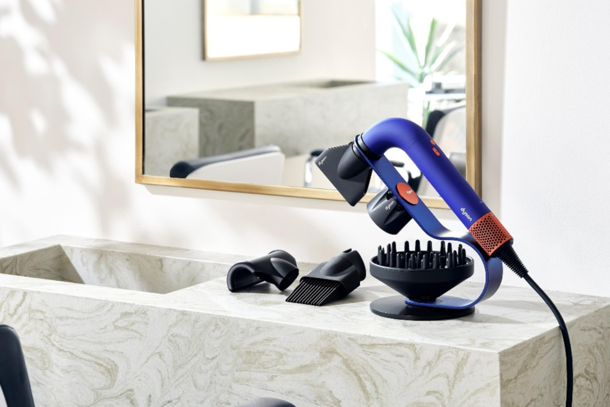 dyson supersonic r pictured by mirror in a hair salon