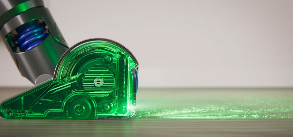 dyson v15 detect vacuum cleaner with the laser shown illuminating the floor