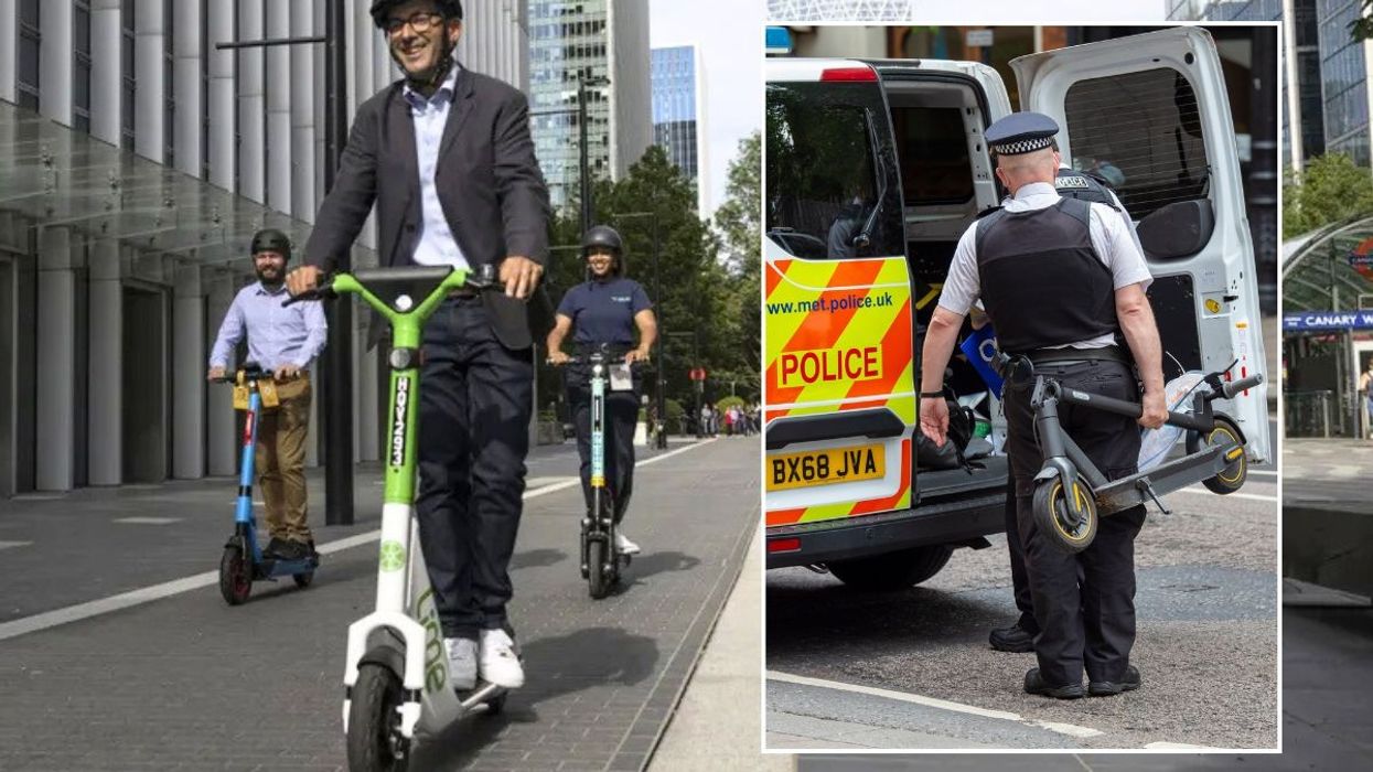 E-scooter and a police officer taking an e-scooter away