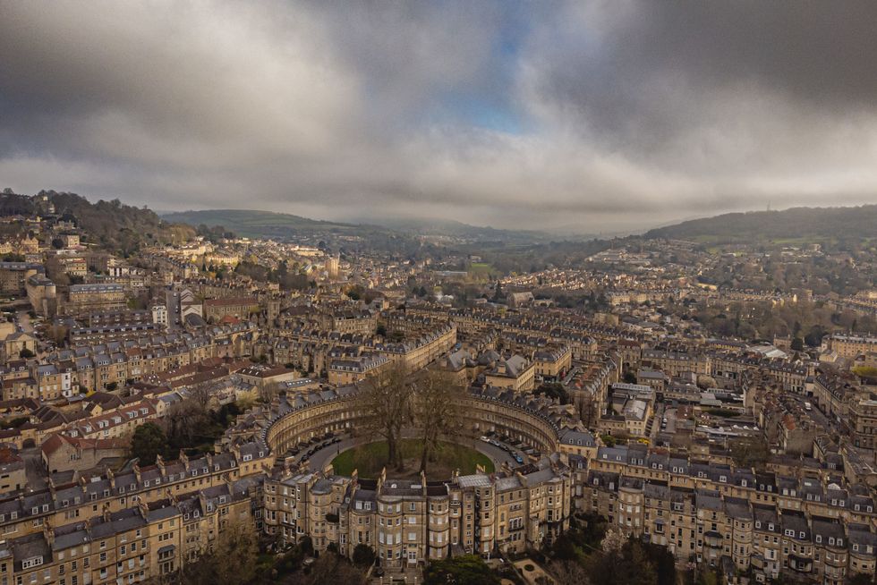 Early morning mist and low cloud cover the city of Bath