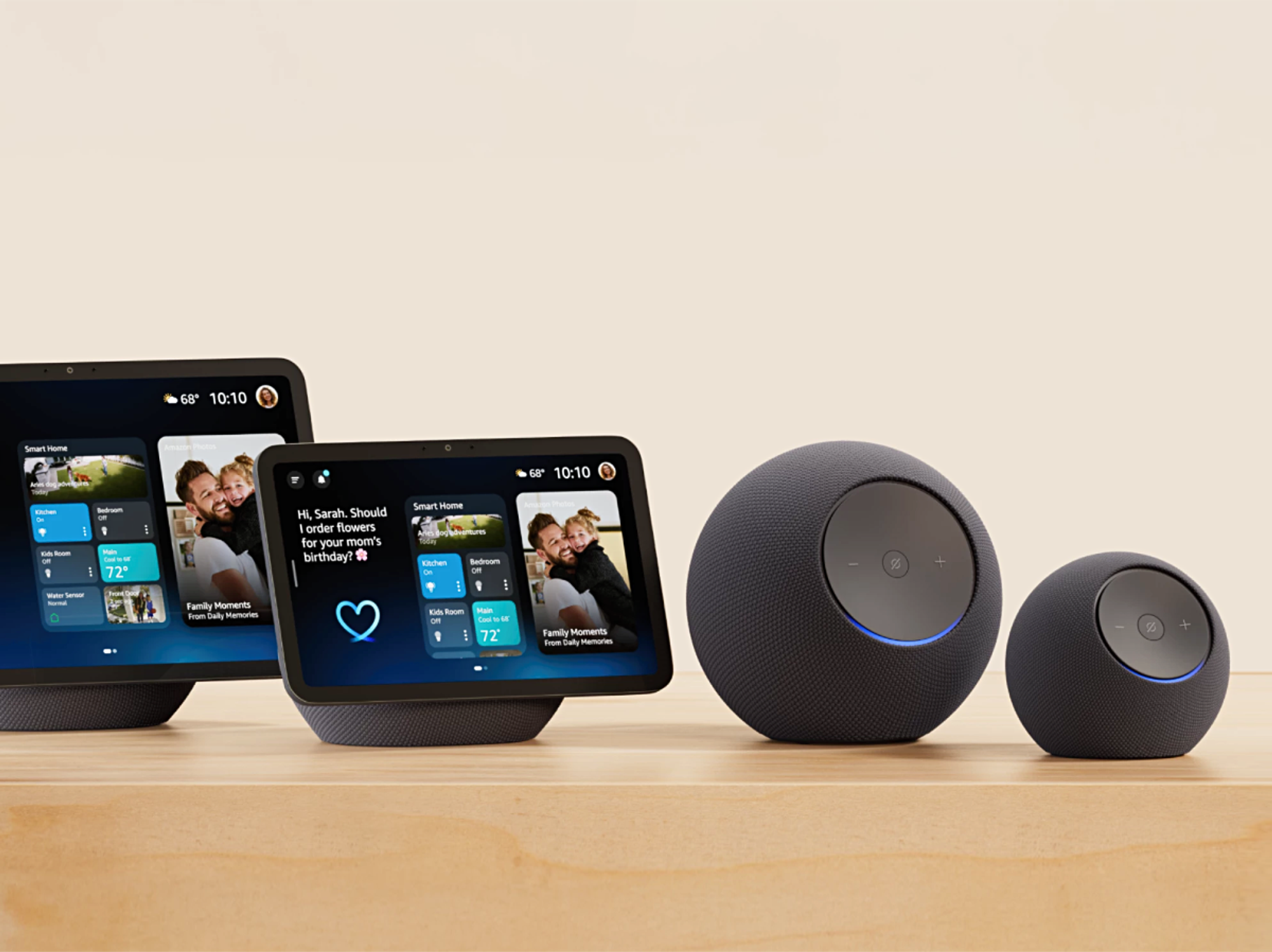 Echo Show 11, Echo Show 8 and Echo Studio and Echo Dot Max pictured side by side on a wooden cabinet