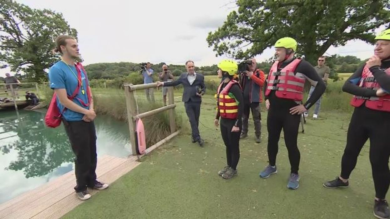 Lib Dem leader Ed Davey dives into lake during election trail