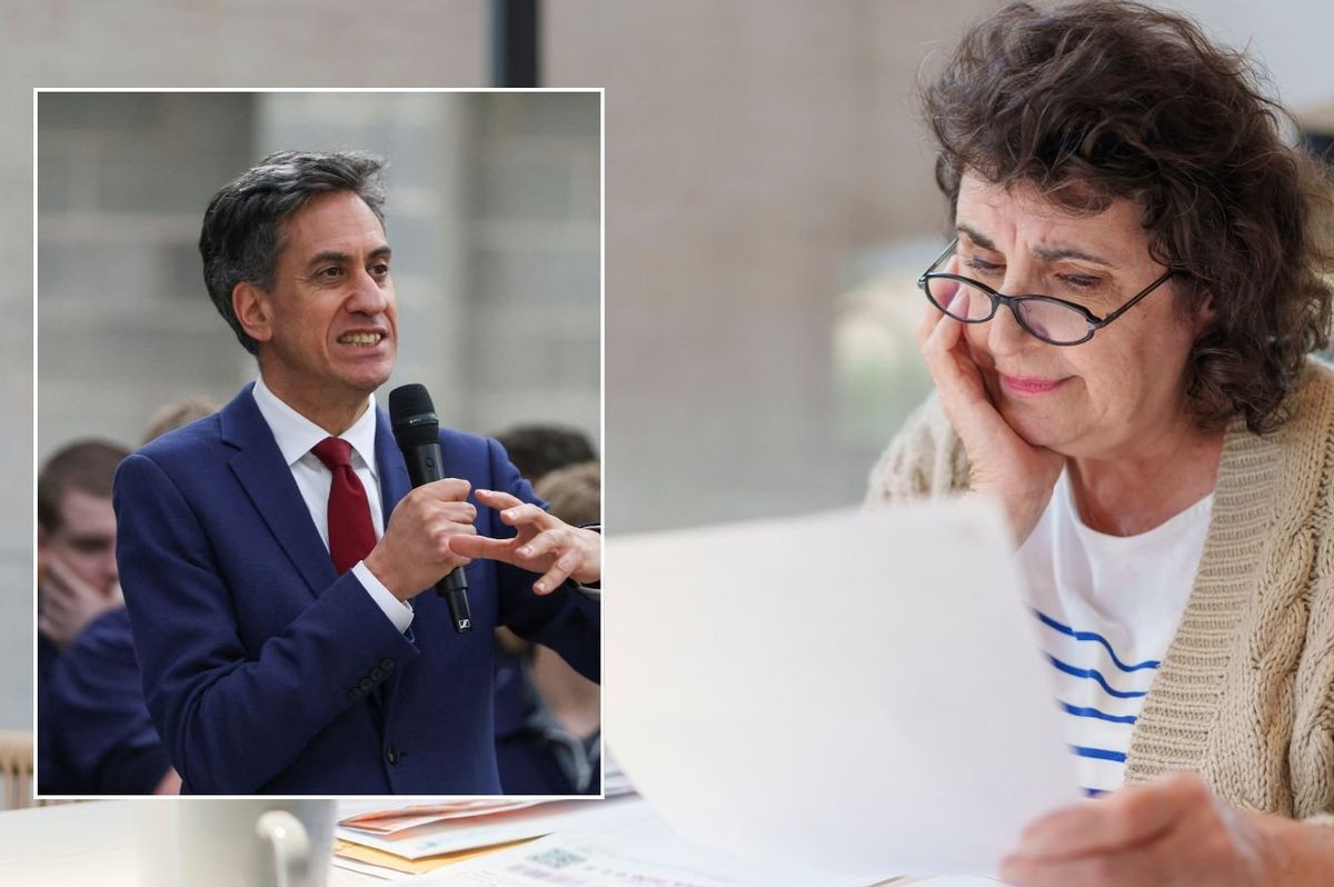 Ed Miliband and older woman looking at energy bill