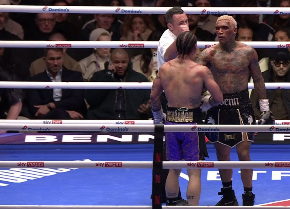 Eddie Hearn, sat next to Chris Eubank Jr and Anthony Joshua, remained stony-faced throughout the contest