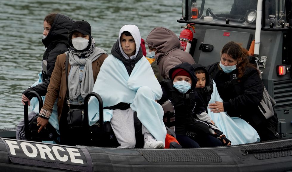 EDITORS NOTE The PA Picture Desk has been unable to gain the necessary permission to photograph children under 16 on issues involving their welfare Children amongst group of people thought to be migrants are brought in to Dover, Kent, onboard a Border Force vessel, following a small boat incident in the Channel. Picture date: Monday May 23, 2022.