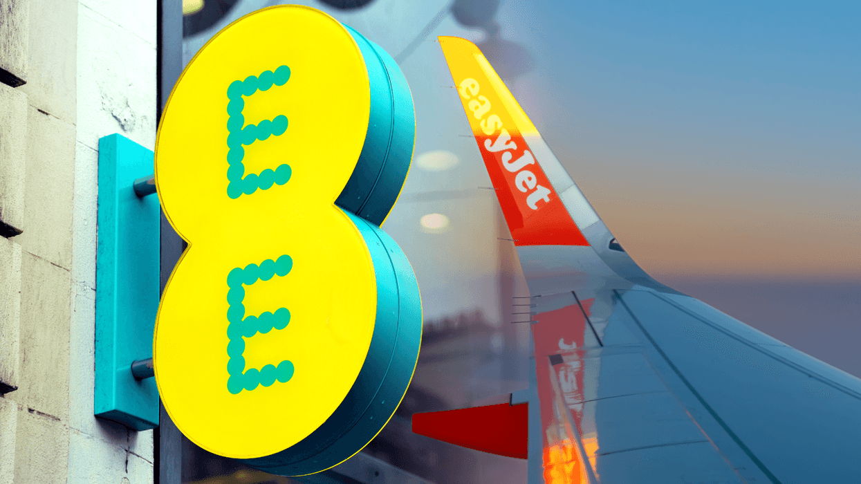 EE logo pictured outside one of its high street stores with the wing of an easyjet plane pictured omn the right side