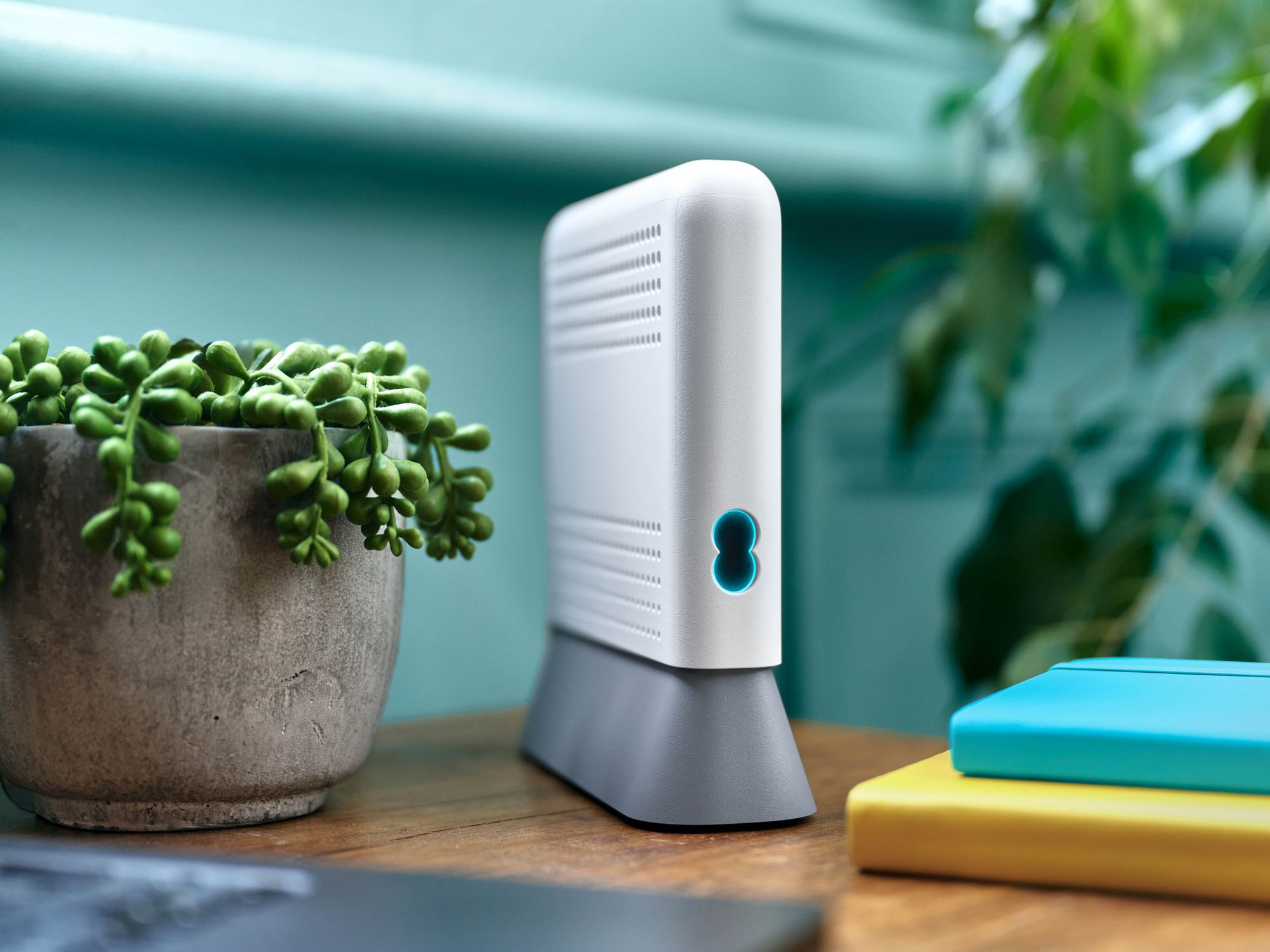 EE Wi-Fi Extender 7 Plus pictured on the side table