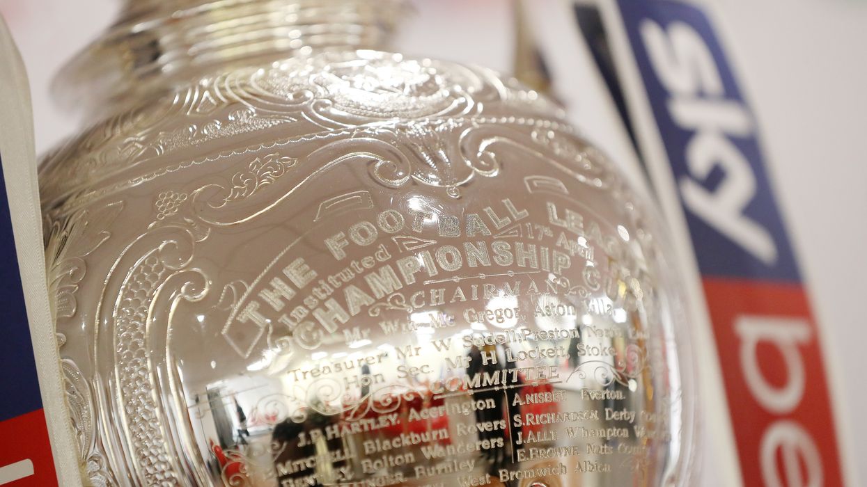 EFL trophy with engraving shown with the Sky Bet banners on either side