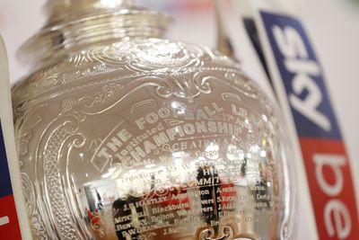 EFL trophy with engraving shown with the Sky Bet banners on either side