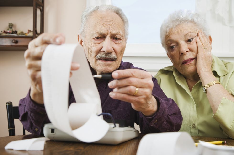 Elderly couple going over finances