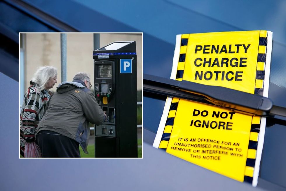 Elderly couple paying for parking and a penalty charge notice