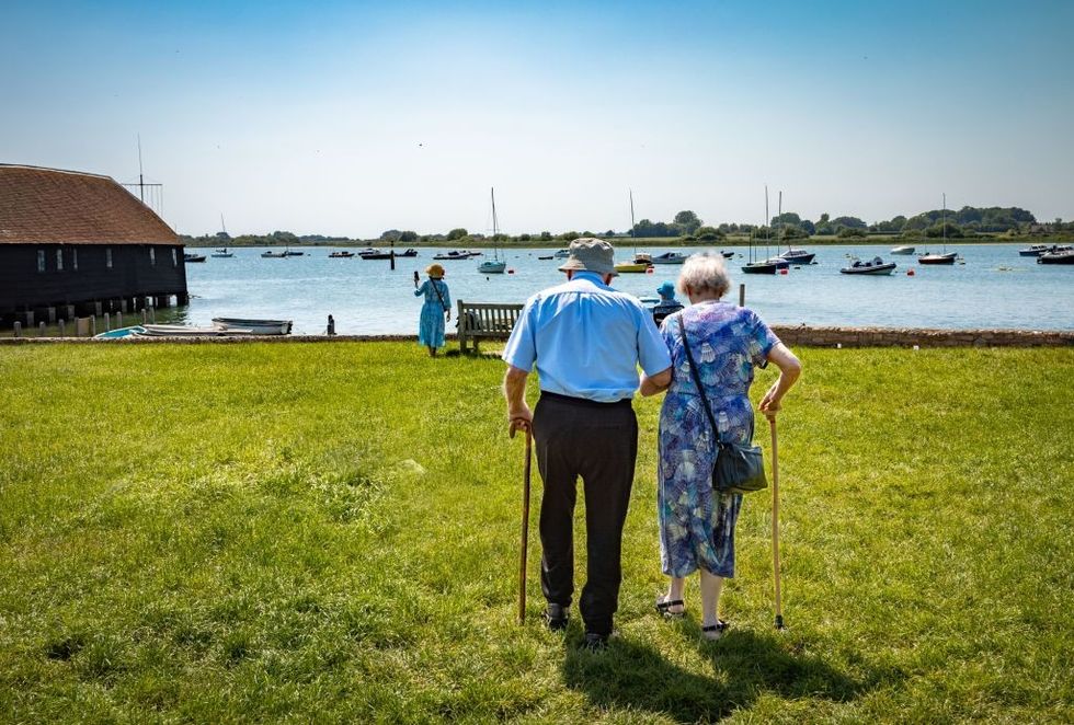 Elderly couple walking in Chichester Harbour
