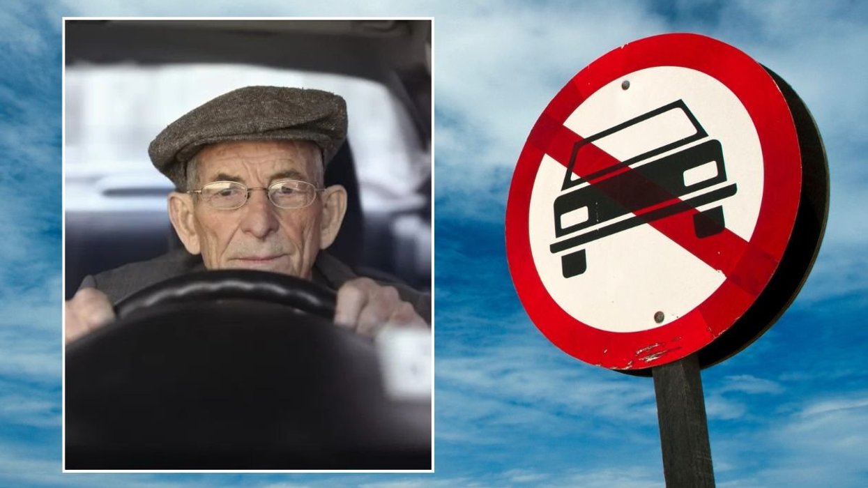 Elderly driver and a car ban sign