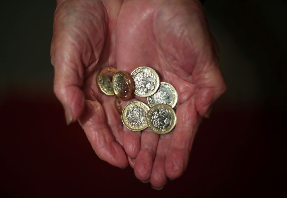 Elderly hands holding money