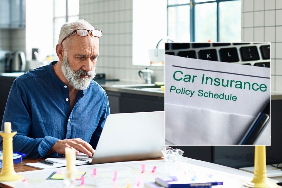 Elderly man looking at a laptop and a car insurance policy schedule
