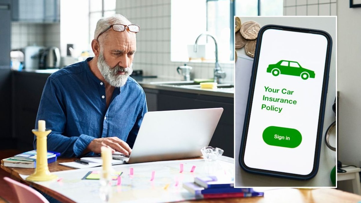 Elderly man looking at a laptop and a car insurance policy