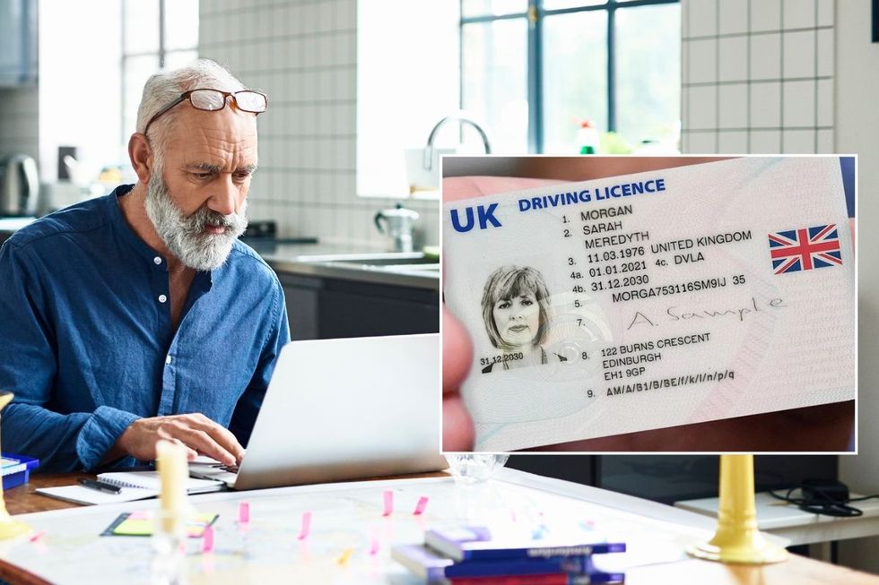 Elderly man looking at a laptop and a UK driving licence