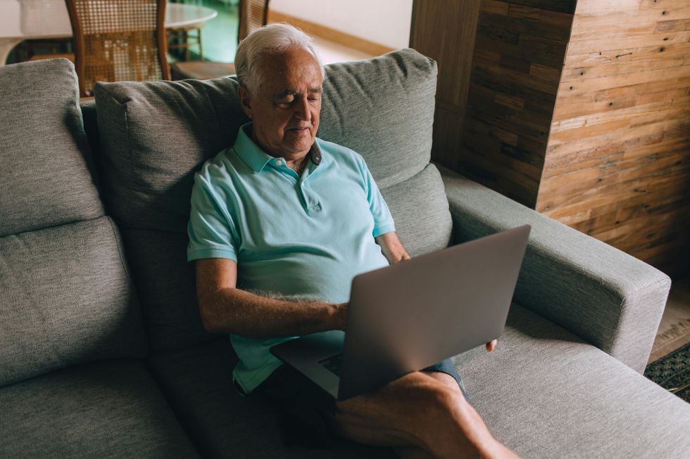 Elderly man using a laptop
