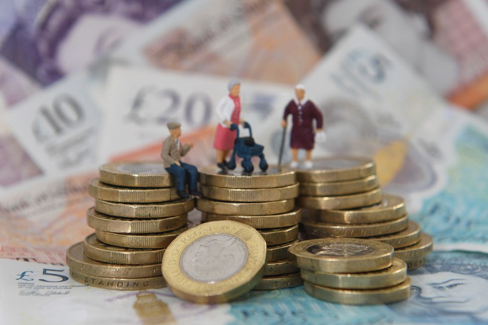 Elderly people on top of a stack of coins