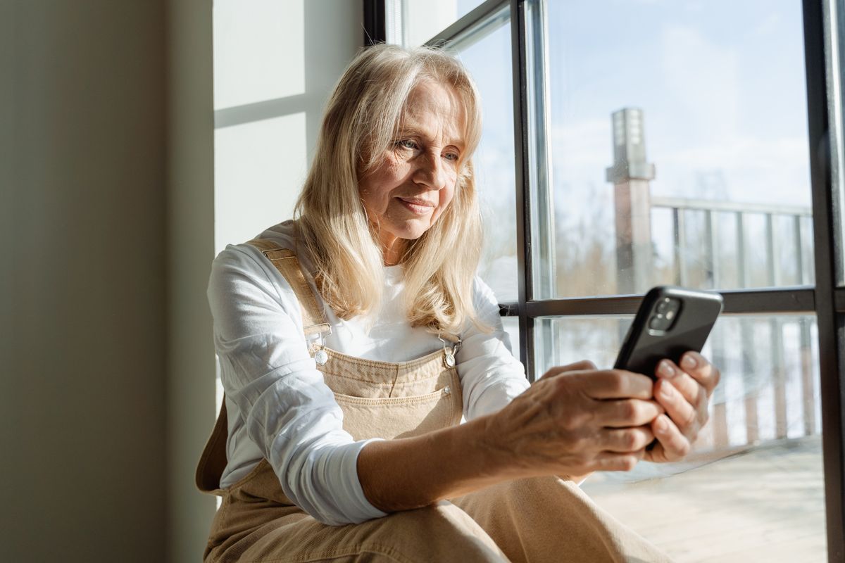 Elderly woman on her phone