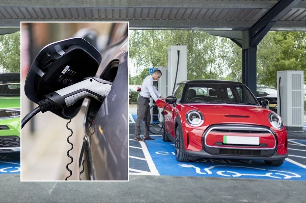 Electric car charger and a driver charging his electric vehicle