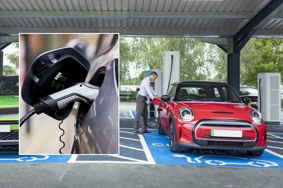 Electric car charger and a man charging an electric car