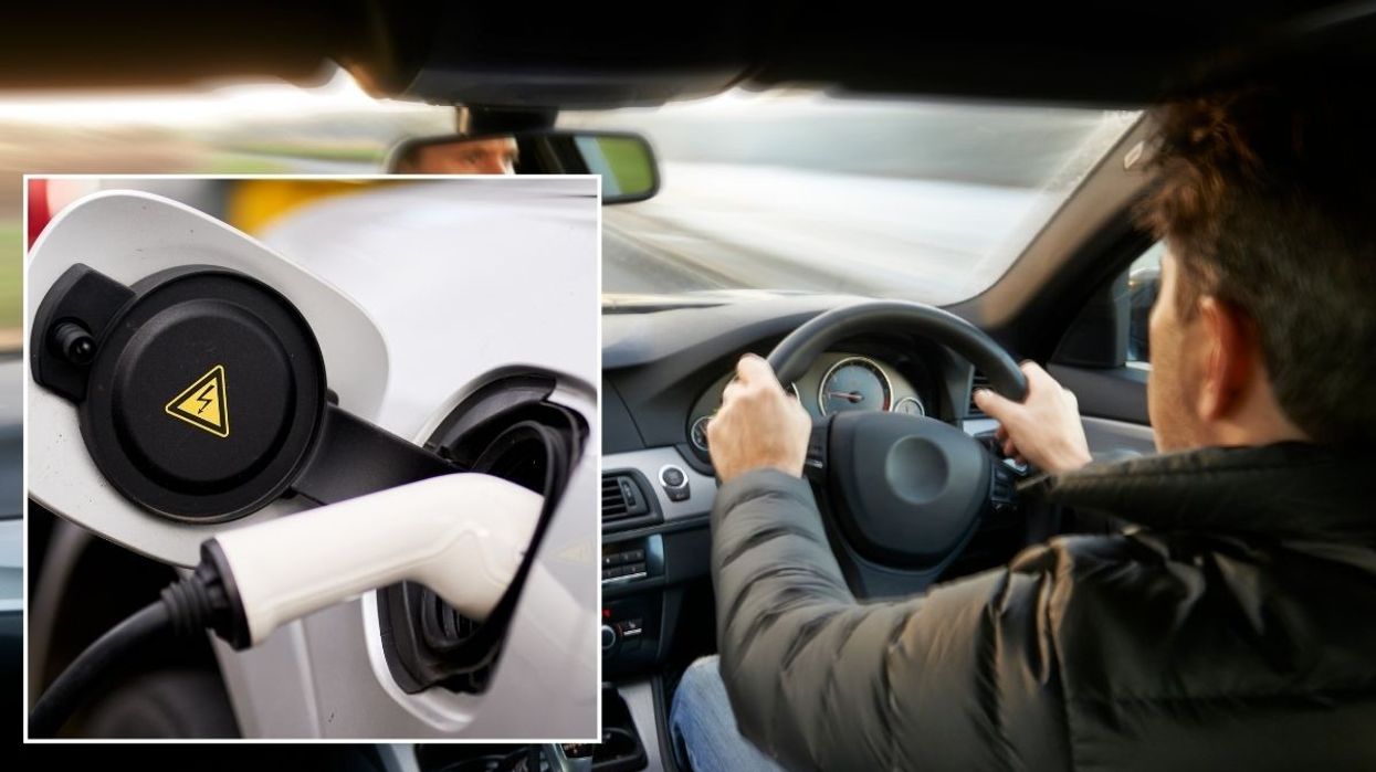 Electric car charger and a person driving