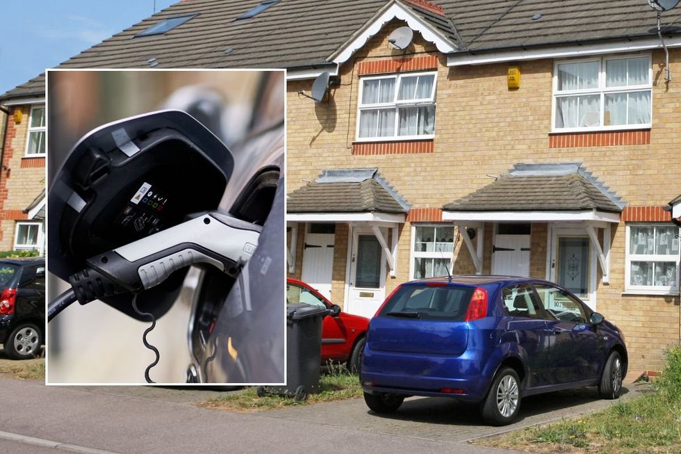 Electric car charger and cars parked at home