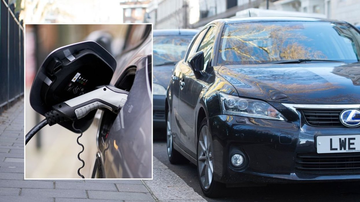 Electric car charger and cars parked on the road