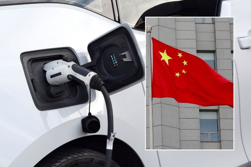 Electric car charging and a Chinese flag